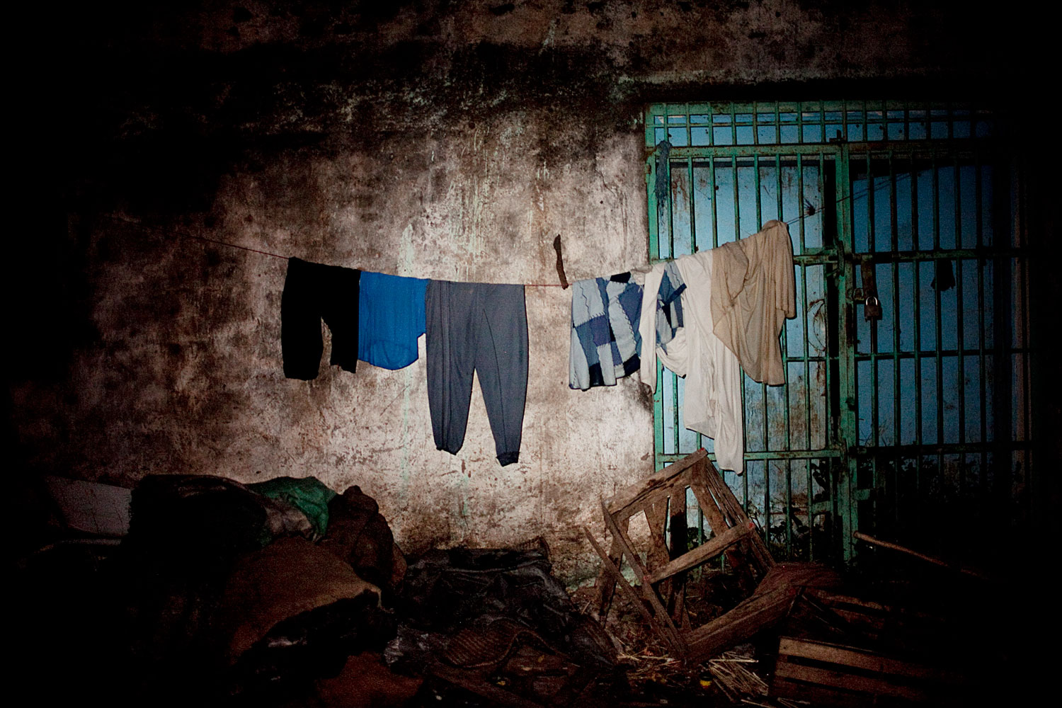 October 6, 2011. Clothing belonging to rebel fighters hangs on a line in Kurmuk, Republic of Sudan. Since fighting began in September, Kurmuk has been abandoned by the civilian population. Shops are shuttered, trash is piling up, the town has come to a standstill.