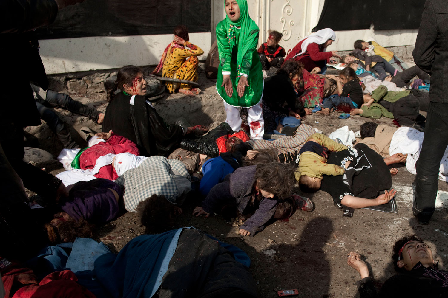 December 6, 2011. Minutes after a blast that killed more than 50 people during the Shiite holy day of Ashura. The explosion happened next to the Abdul Faz mosque, Afghanistan. Kabul, in a crowd watching Hazara Afghans  performing zanjeer--ritual flagellation.