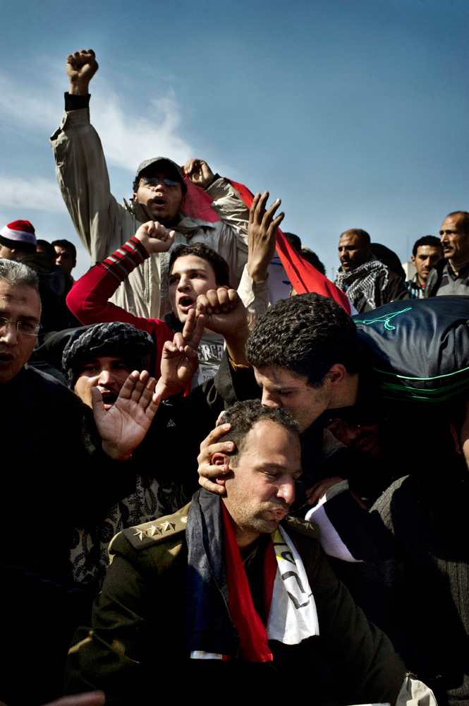 Cairo, Egypt — February 2, 2011
                              To win the army over to their side, protest leaders urged the people to  hug a soldier.