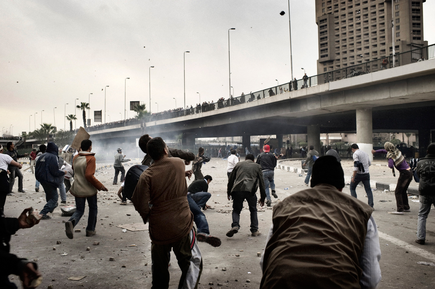 Cairo, Egypt — February 3, 2011
                              Anti-Mubarak protesters throw rocks.