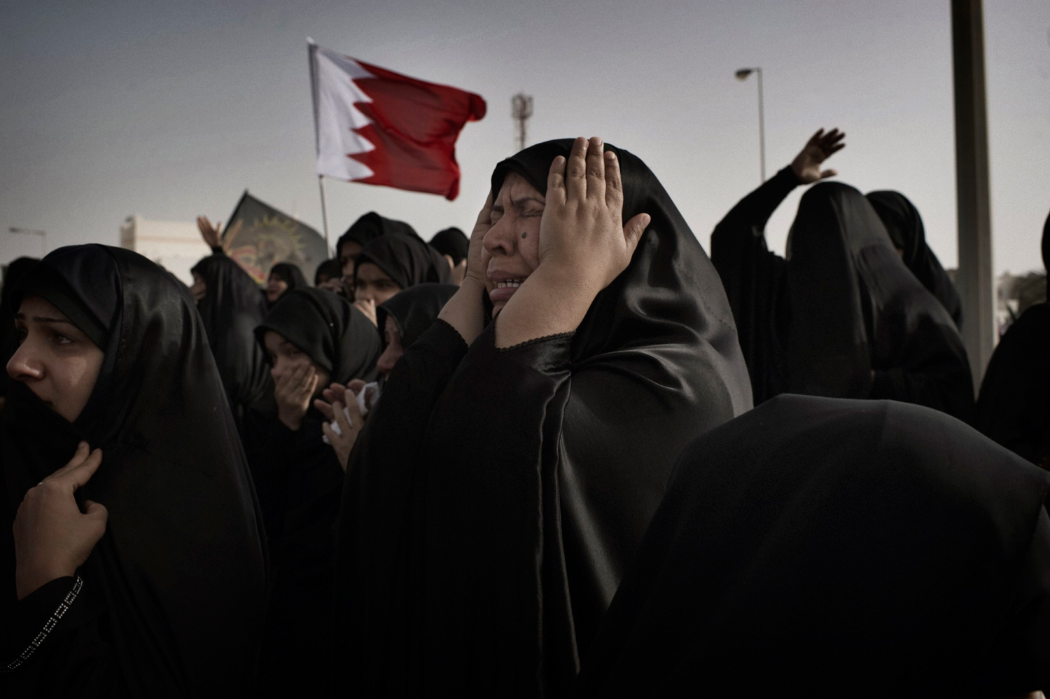 Malkiya, Bahrain — February 22, 2011
                              A woman takes part in the funeral procession for anti-government protester Abdul Ridha Mohammed, who had been shot in the head when Bahraini security forces attacked anti-government demonstrators in Pearl Roundabout the previous week.