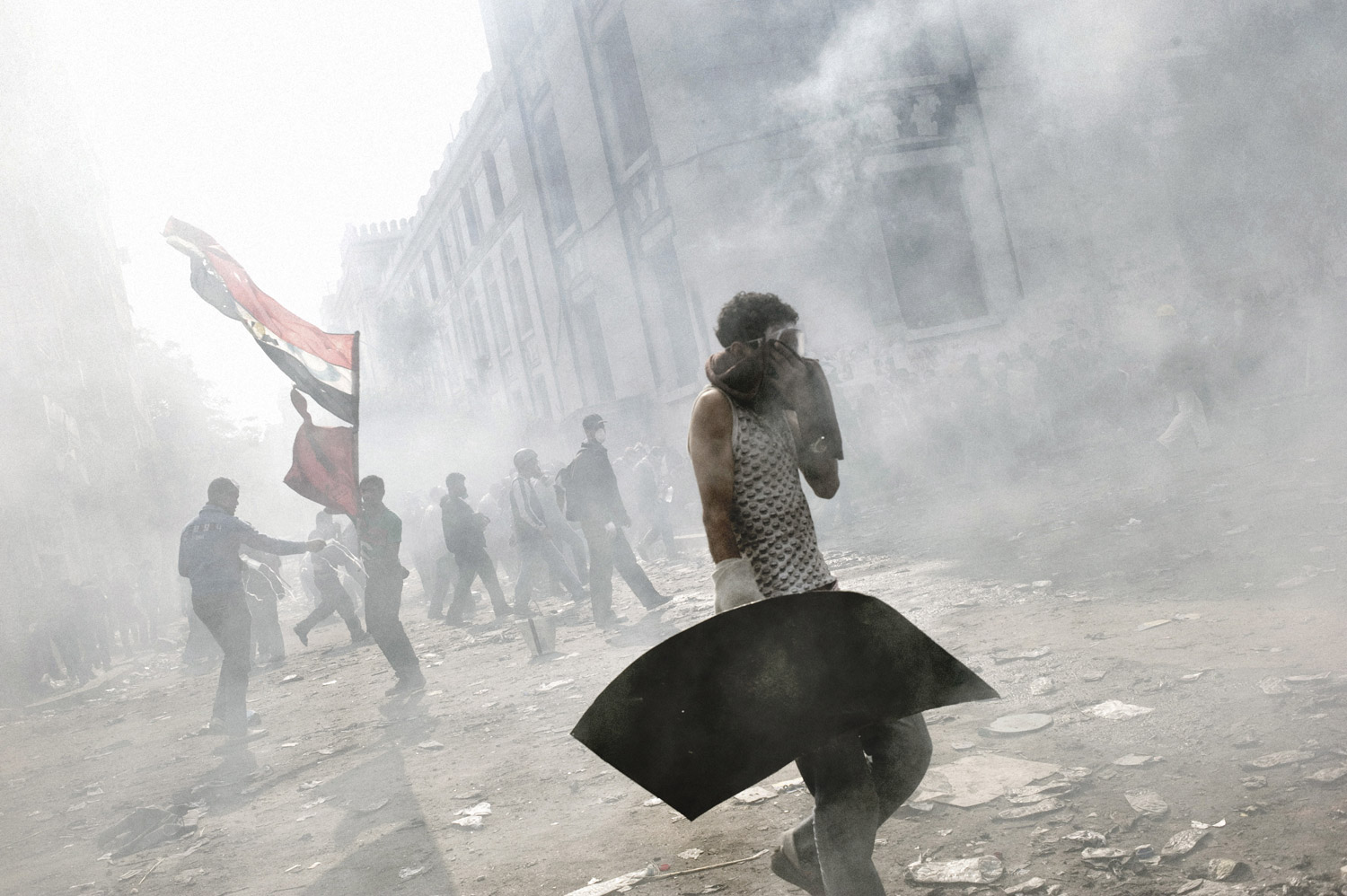 Tear gas fired by Egyptian security forces blankets a group of protesters, November 23, 2011.