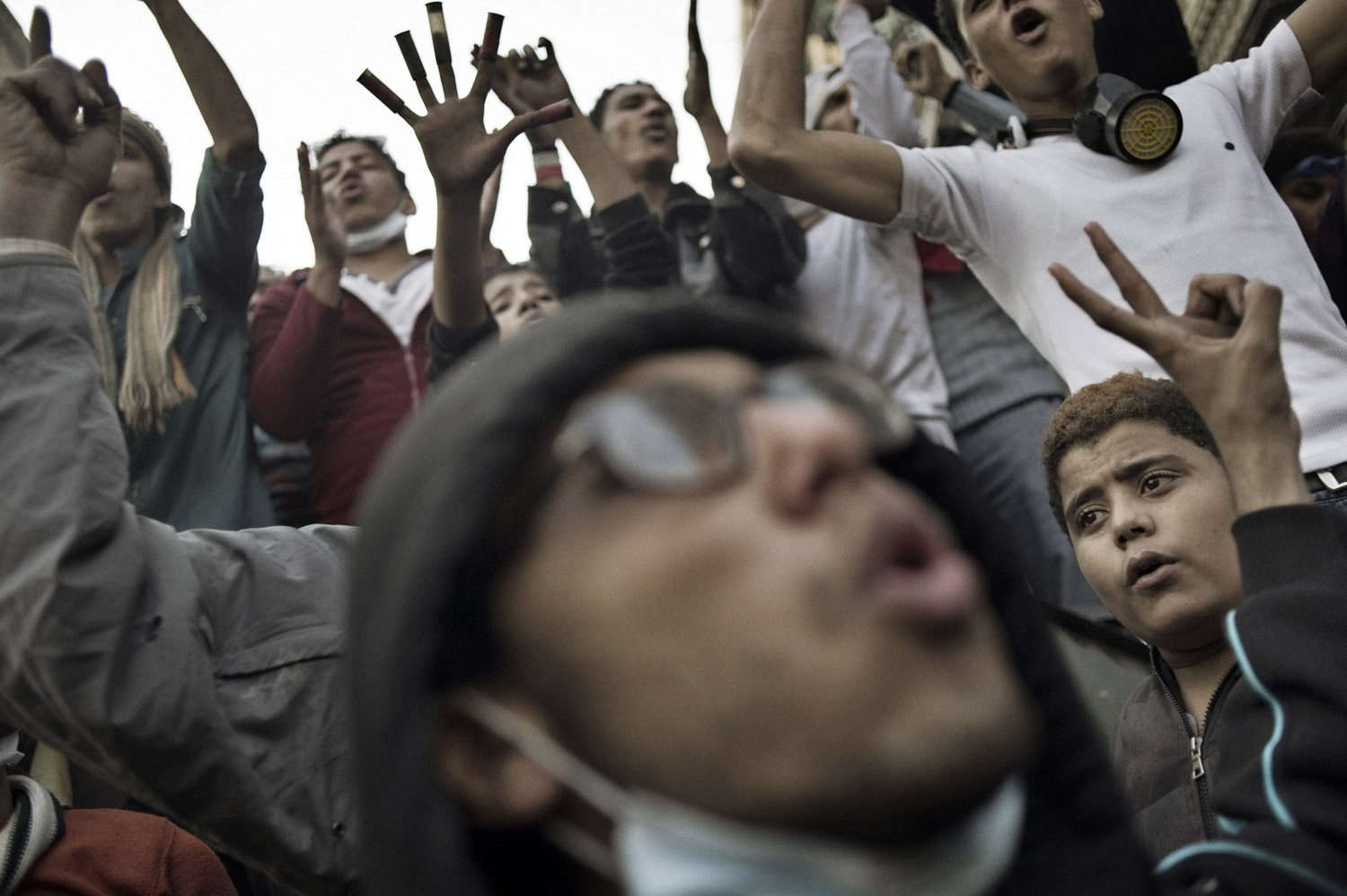 Protesters chant anti-military council slogans at a barricade during a temporary cease-fire with Egyptian security forces, November 23, 2011.