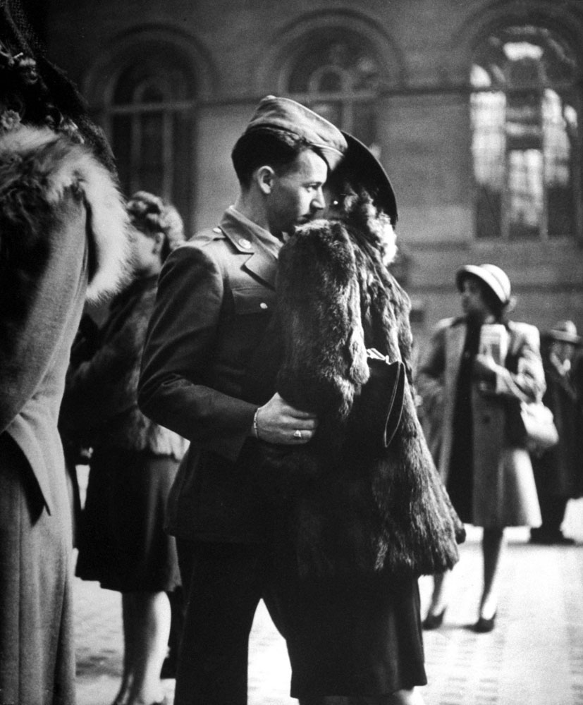A soldier saying farewell at Penn Station in December 1943.