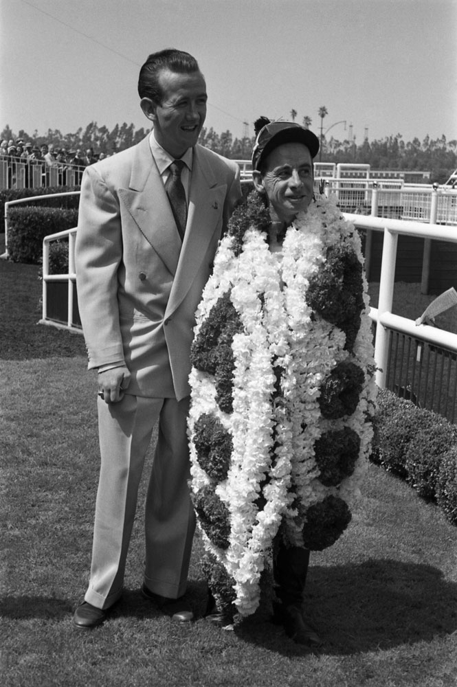 Johnny Longden poses after his 4,000th career win in 1952.