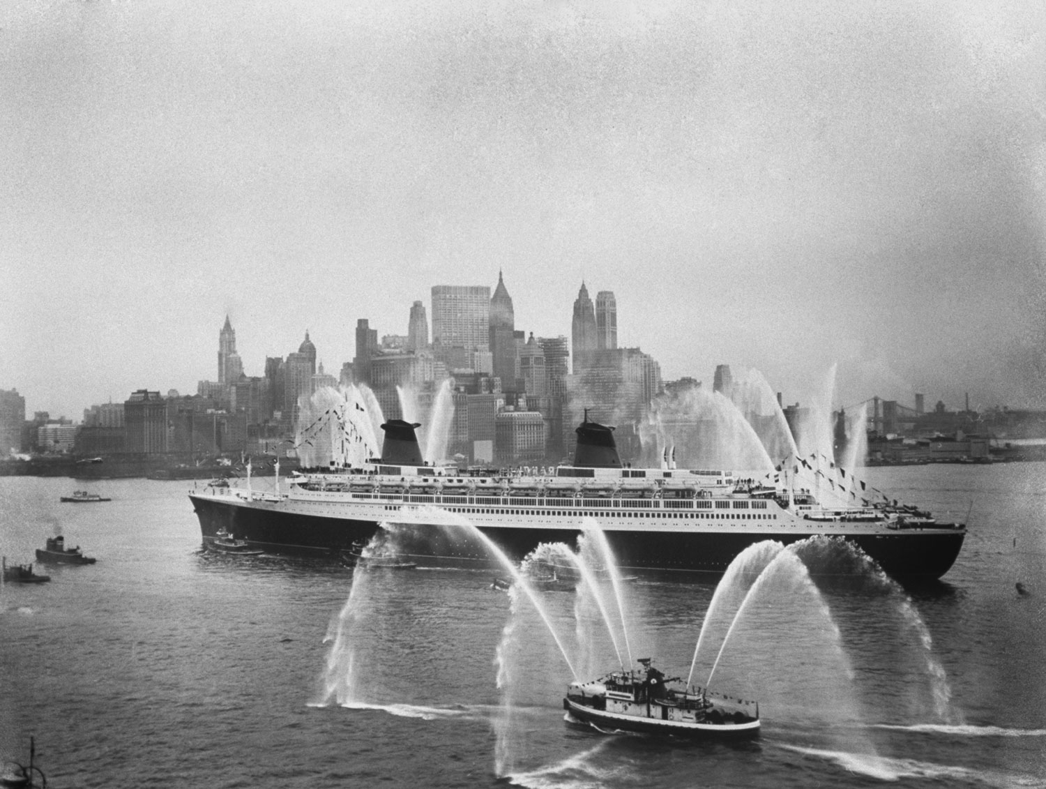 Fire boats greet the SS France as it enters New York Harbor on its maiden voyage in February 1962.