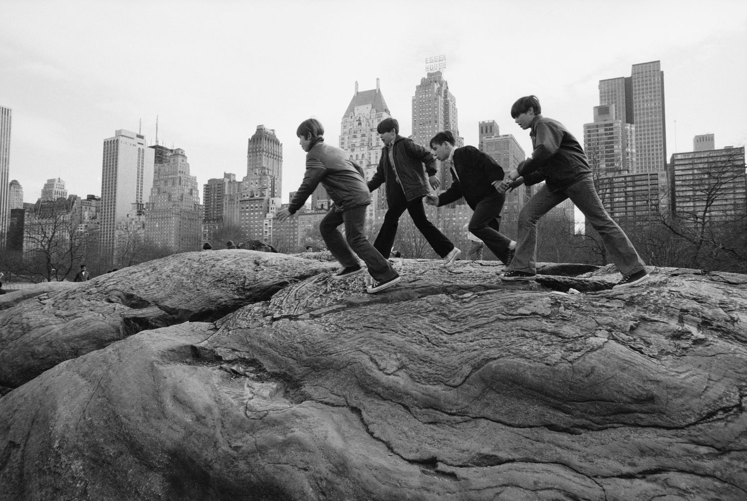 Boys climb on rocks in Central Park, November 1972.