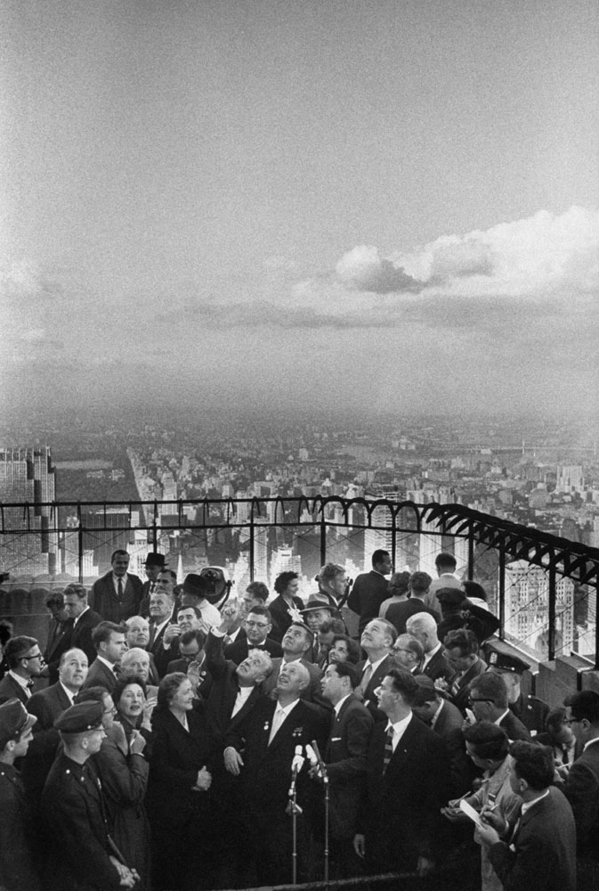 Nikita S. Khrushchev and his wife, center, meet the press at the top of the Empire State building in September 1959.