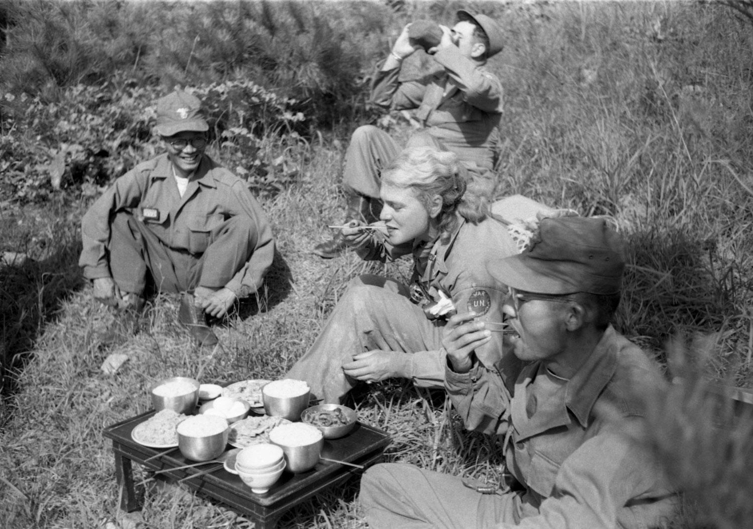 LIFE's Margaret Bourke-White shares a meal with South Korean troops in the field, 1952.