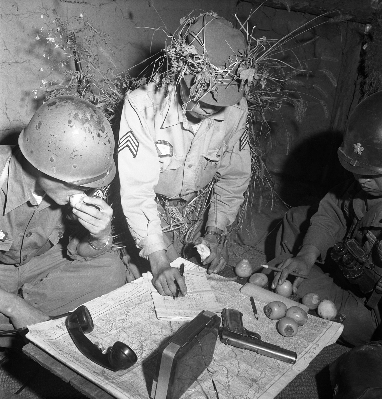 South Korean and American officers pore over maps in a 1952 Margaret Bourke-White photo.