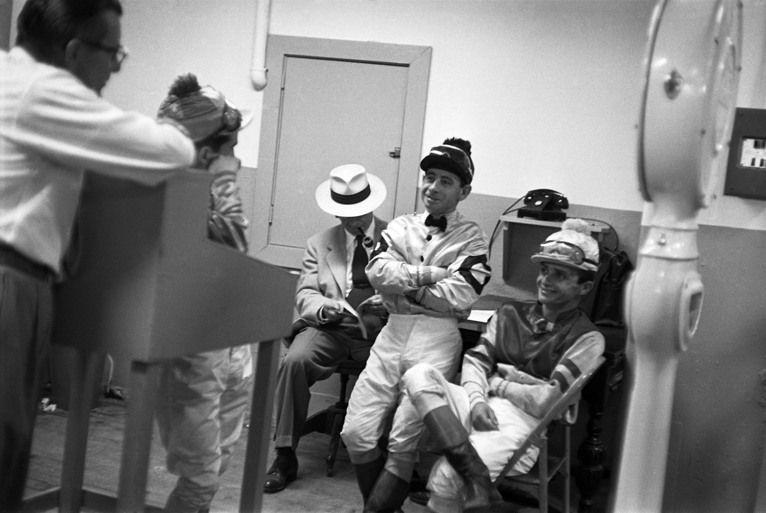 Johnny Longden (second from right) with fellow jockeys, Hollywood Park, 1952.