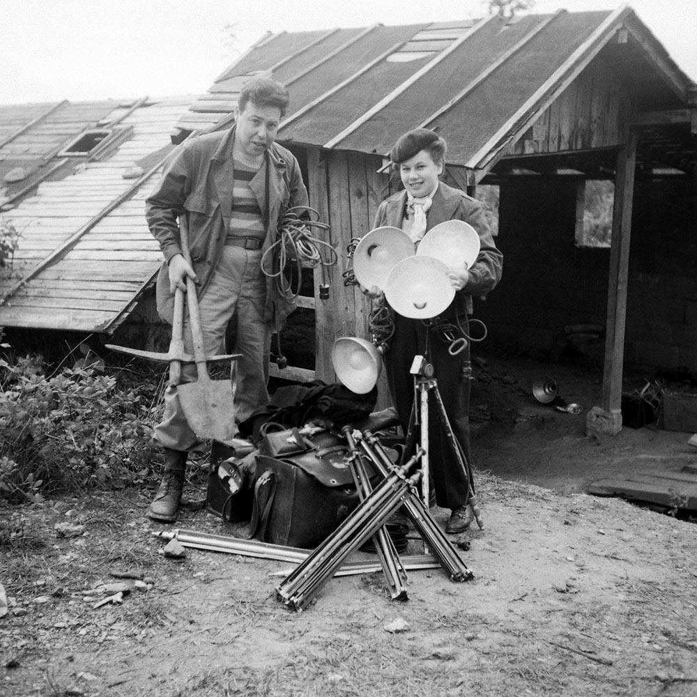 Ralph Morse and his wife, Ruth, stand outside the entrance to Lascaux with some of the photography and lighting equipment that was eventually hauled down into the cave, 1947.