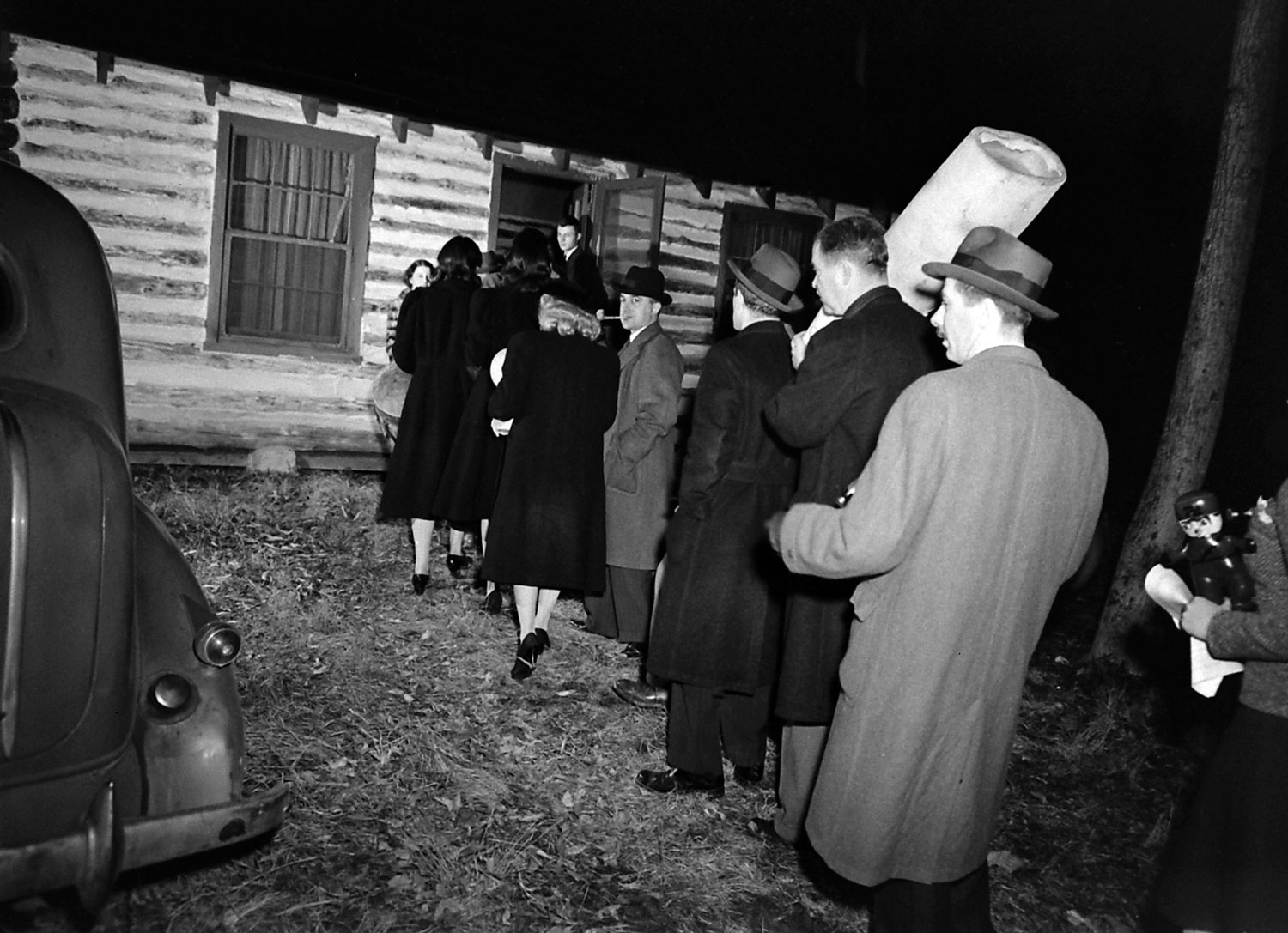 Revelers make their way to a "Hitler hex party" in the Maryland Woods, 1941.
