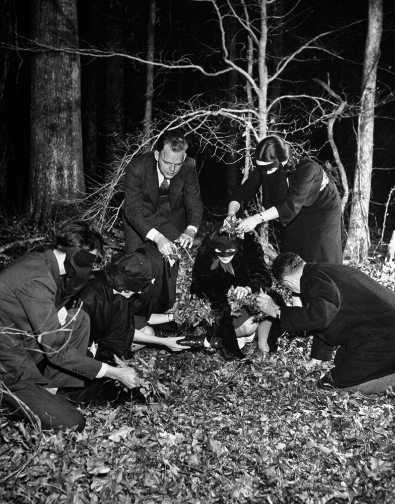 Hitler is buried in deep pine woods to be devoured by worms," wrote LIFE of this final image in the article. "After burial, hexers were exhausted by compounded impact of drums, ritual, emotion.