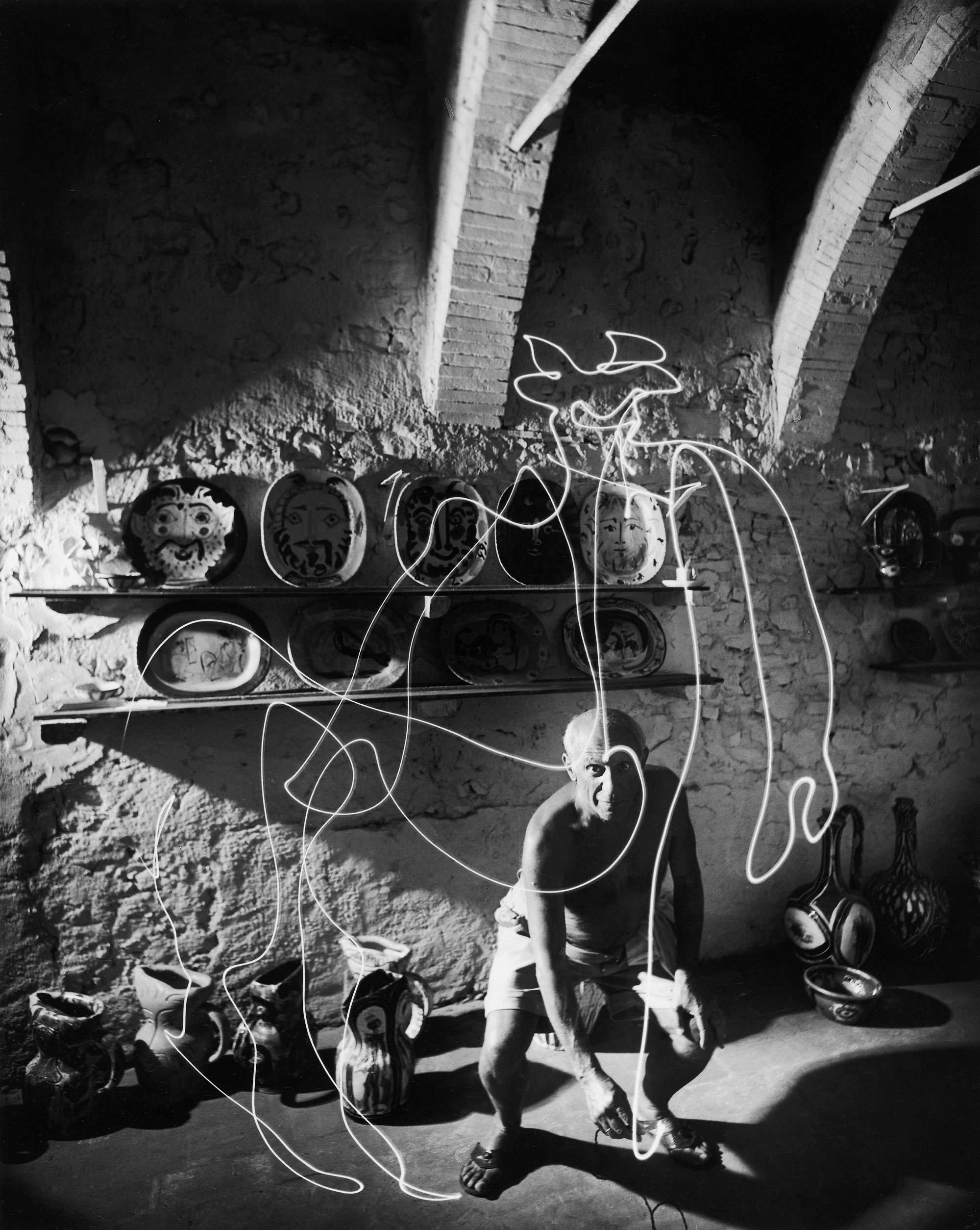 Pablo Picasso "draws" a centaur in the air with light, 1949.