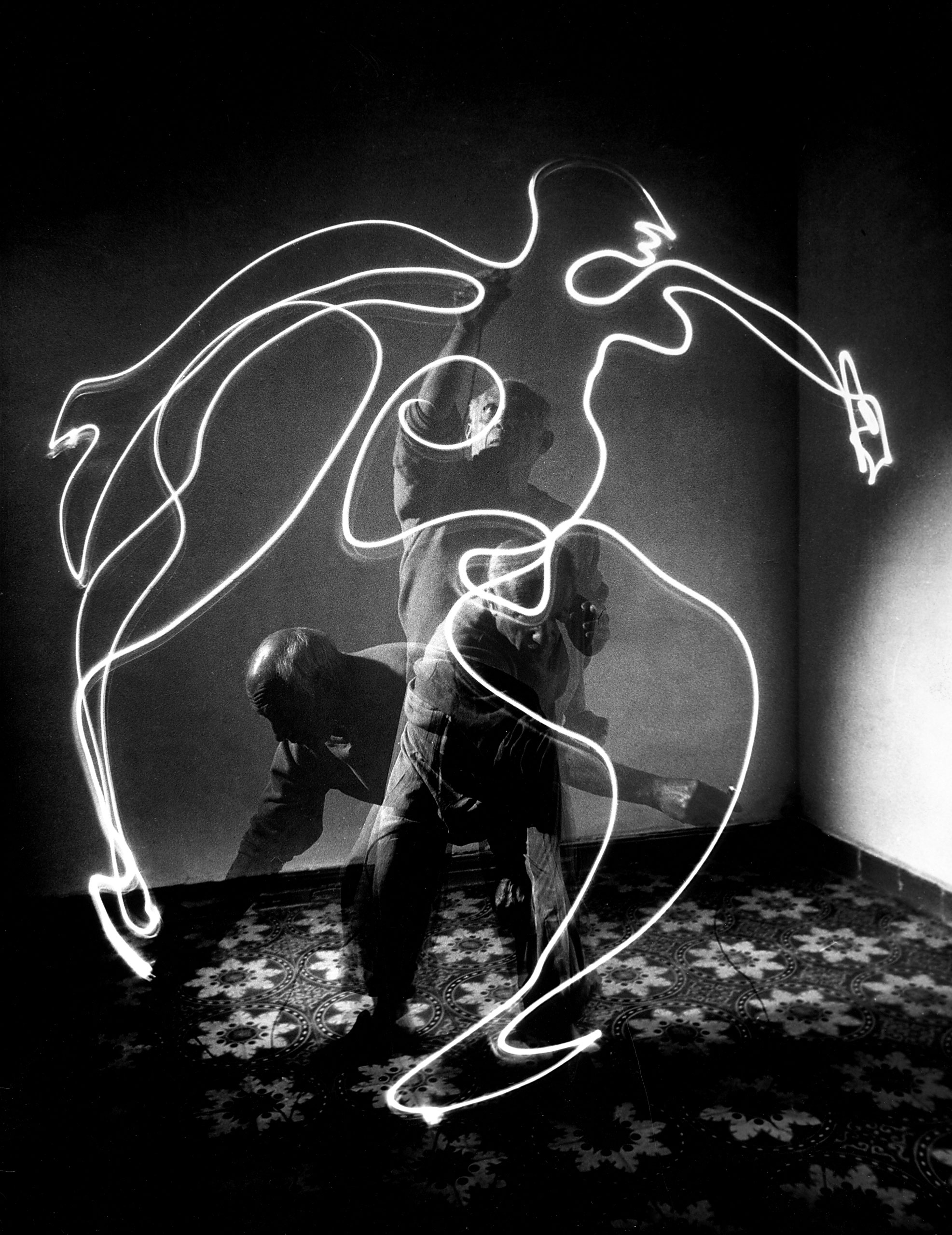 Pablo Picasso creates a figure with light, 1949.