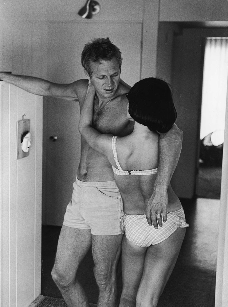 Steve McQueen and his first wife, TV actress Neile Adams, dress for a warm day at their Hollywood home in 1963.