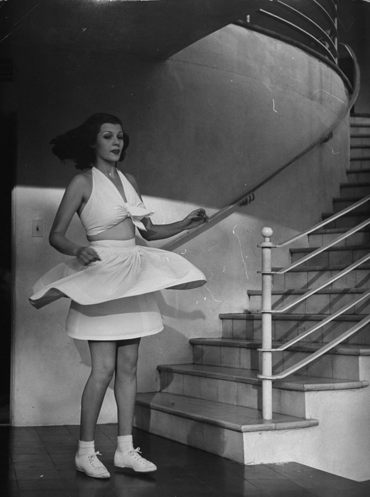 Margarita Carmen Cansino, soon to be Rita Hayworth, models tennis fashions in 1939.