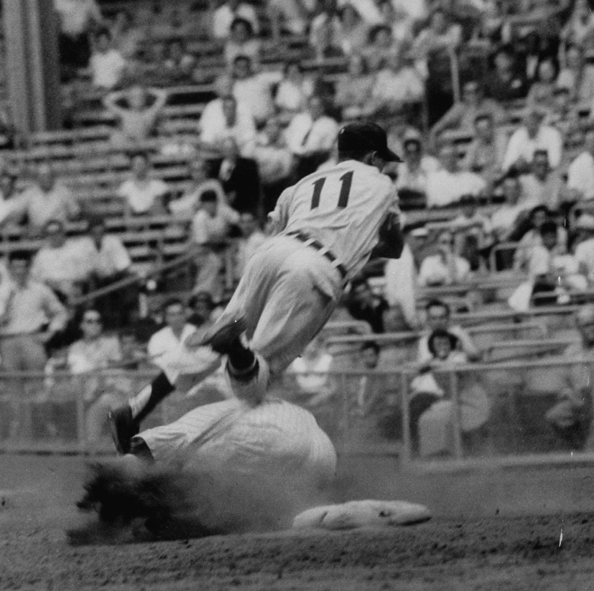 Mickey Mantle slams into Luis Aparicio's feet while sliding into second, June 1956.