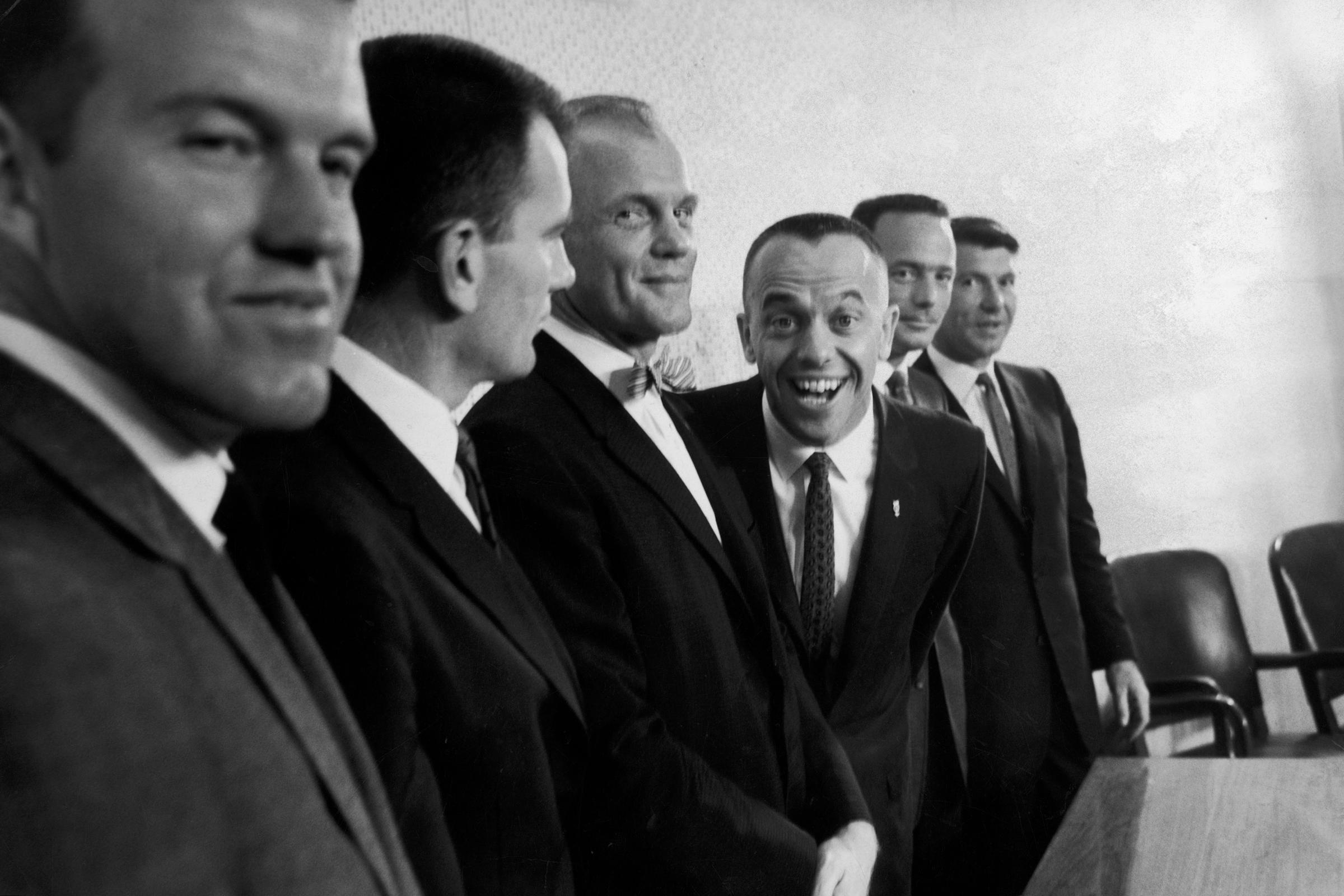 (L-R) Six of the original seven Project Mercury astronauts: Gordon Cooper, Deke Slayton, John Glenn, Alan Shepard, Scott Carpenter and Wally Schirra, press conference, 1961.