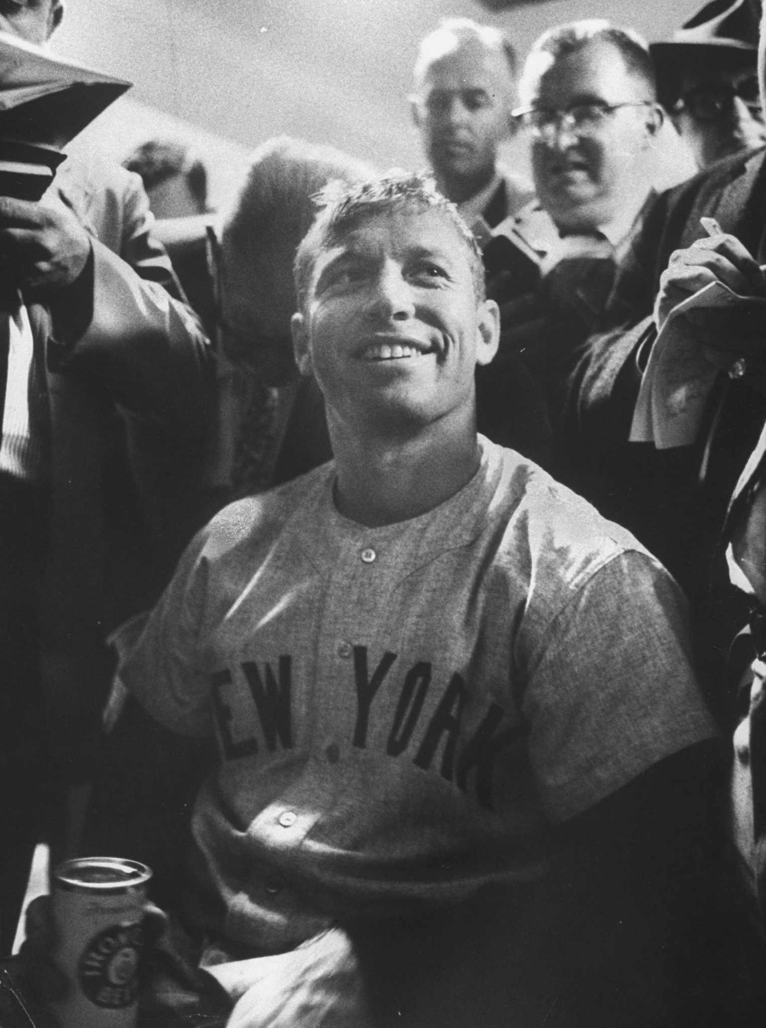 Surrounded by the press, Mickey Mantle, center, smiles after hitting two home runs in the World Series against the Pittsburgh Pirates in October 1960.