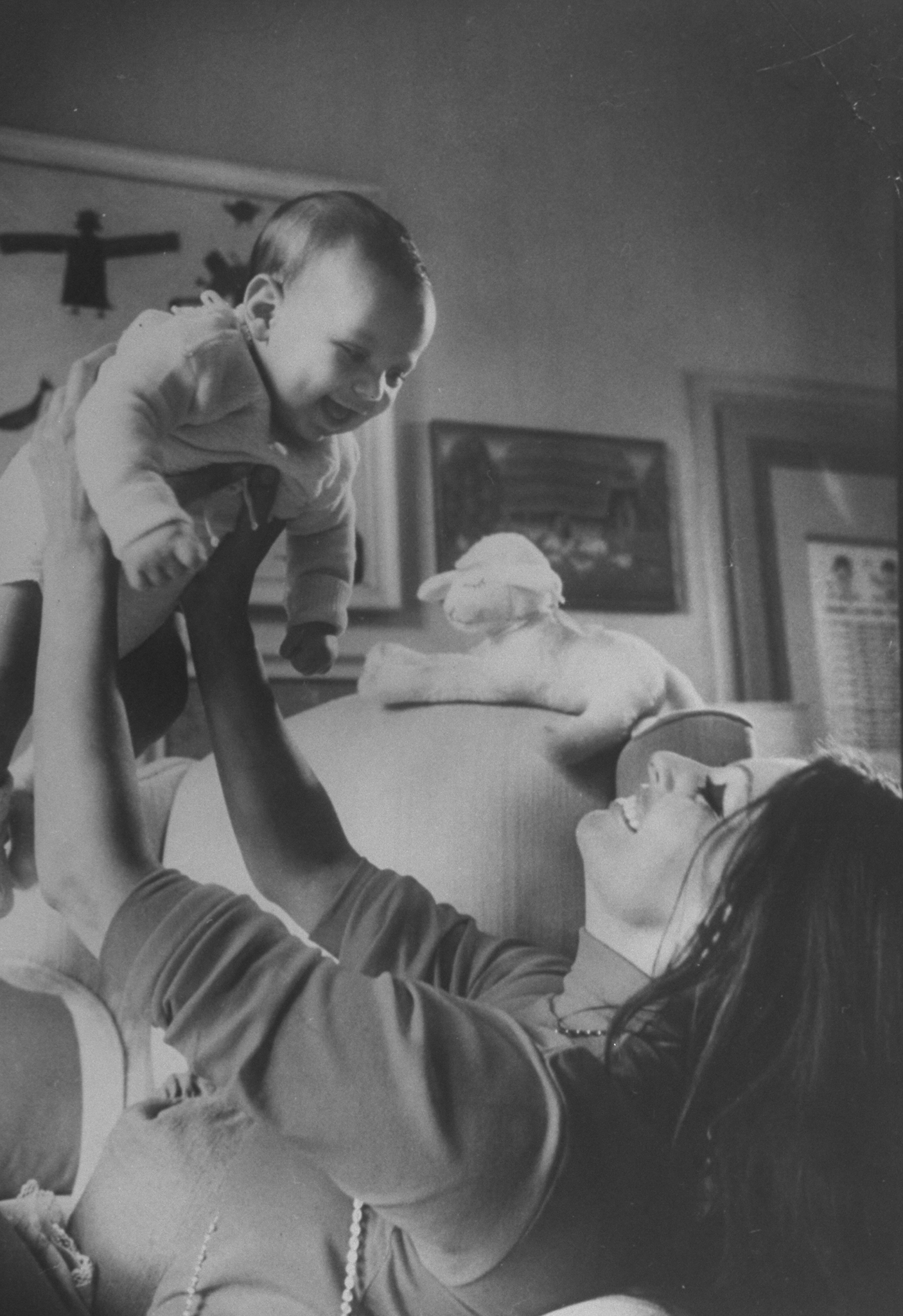 Sophia Loren lifts son Carlo Ponti Jr. in air at home in Rome in 1969