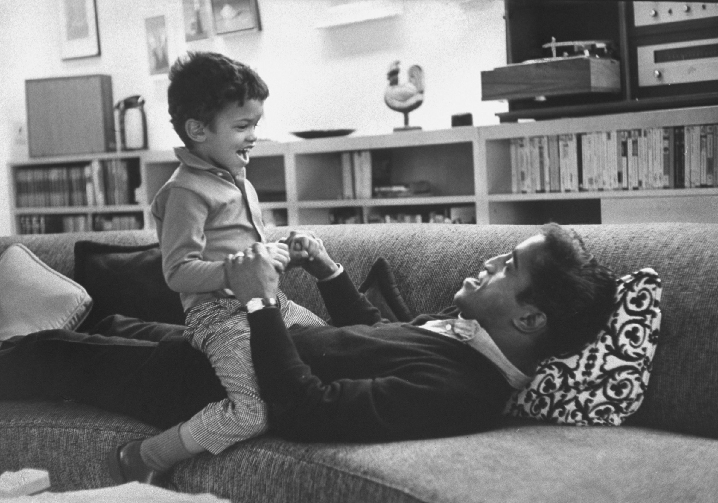 Sammy Davis Jr. Plays With Son on couch in 1964