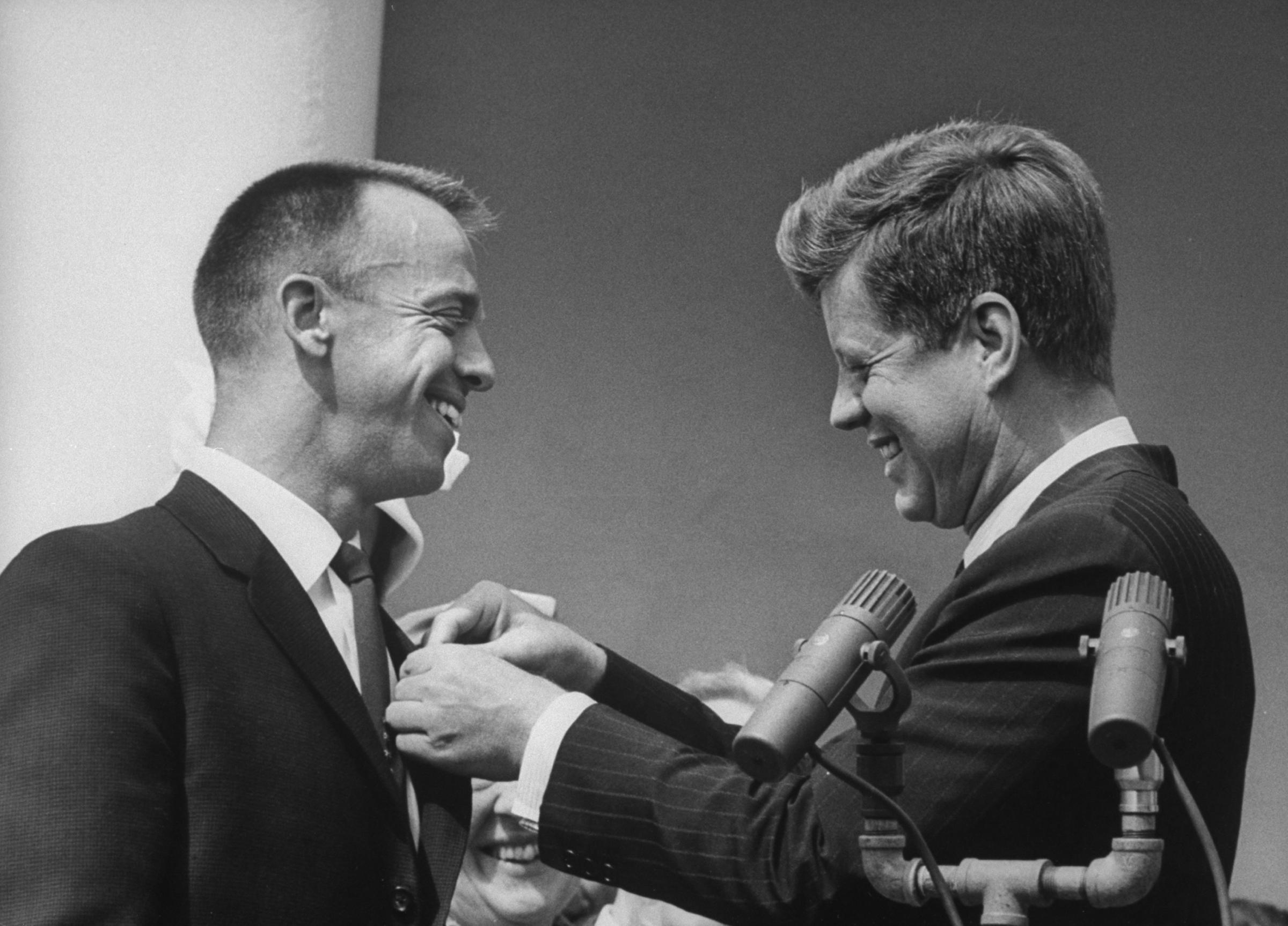 President John Kennedy pins NASA's Distinguished Service Medal on Alan Shepard's chest, May 8, 1961.