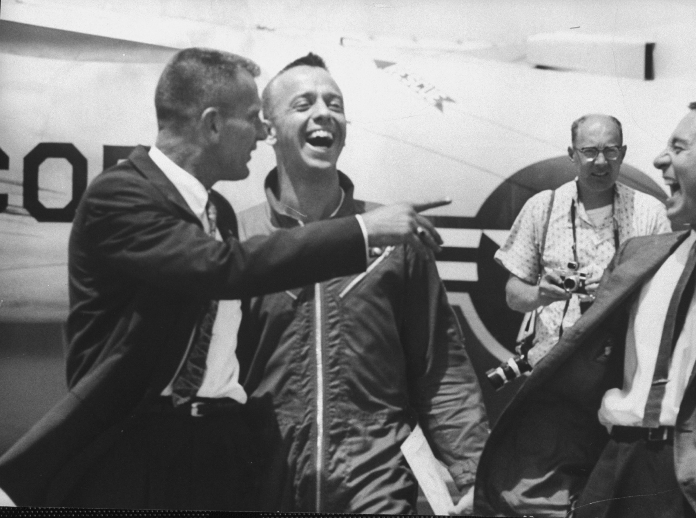 In an image that captures the at-once easy and intense bond among the Mercury 7, Shepard laughs with fellow astronauts Gus Grissom (right) and Deke Slayton upon his arrival at Grand Bahama Island, shortly after his successful flight and splashdown, May 1961.