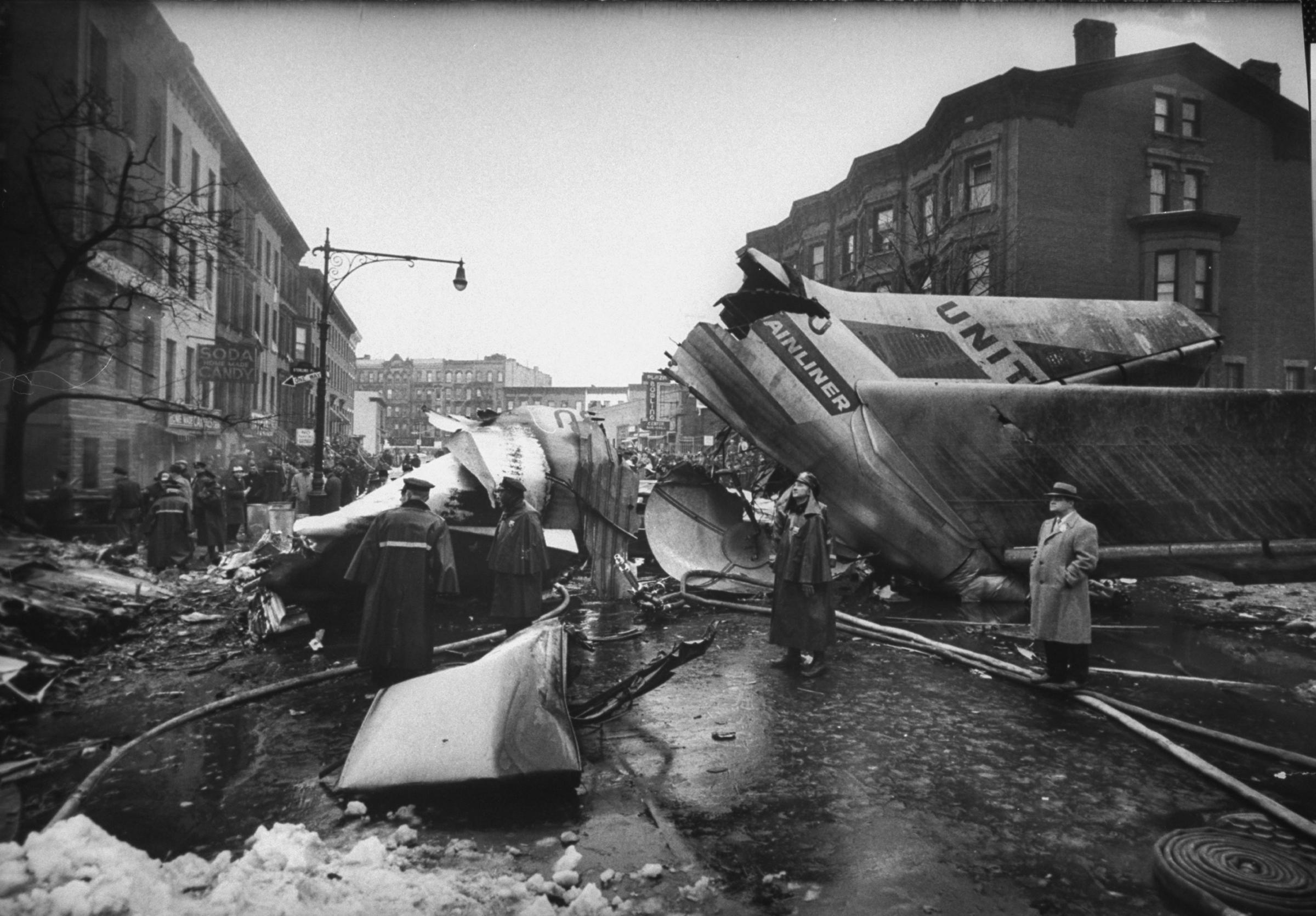 Wreckage litters the streets of Brooklyn after two airliners collide above the borough, December 1960.