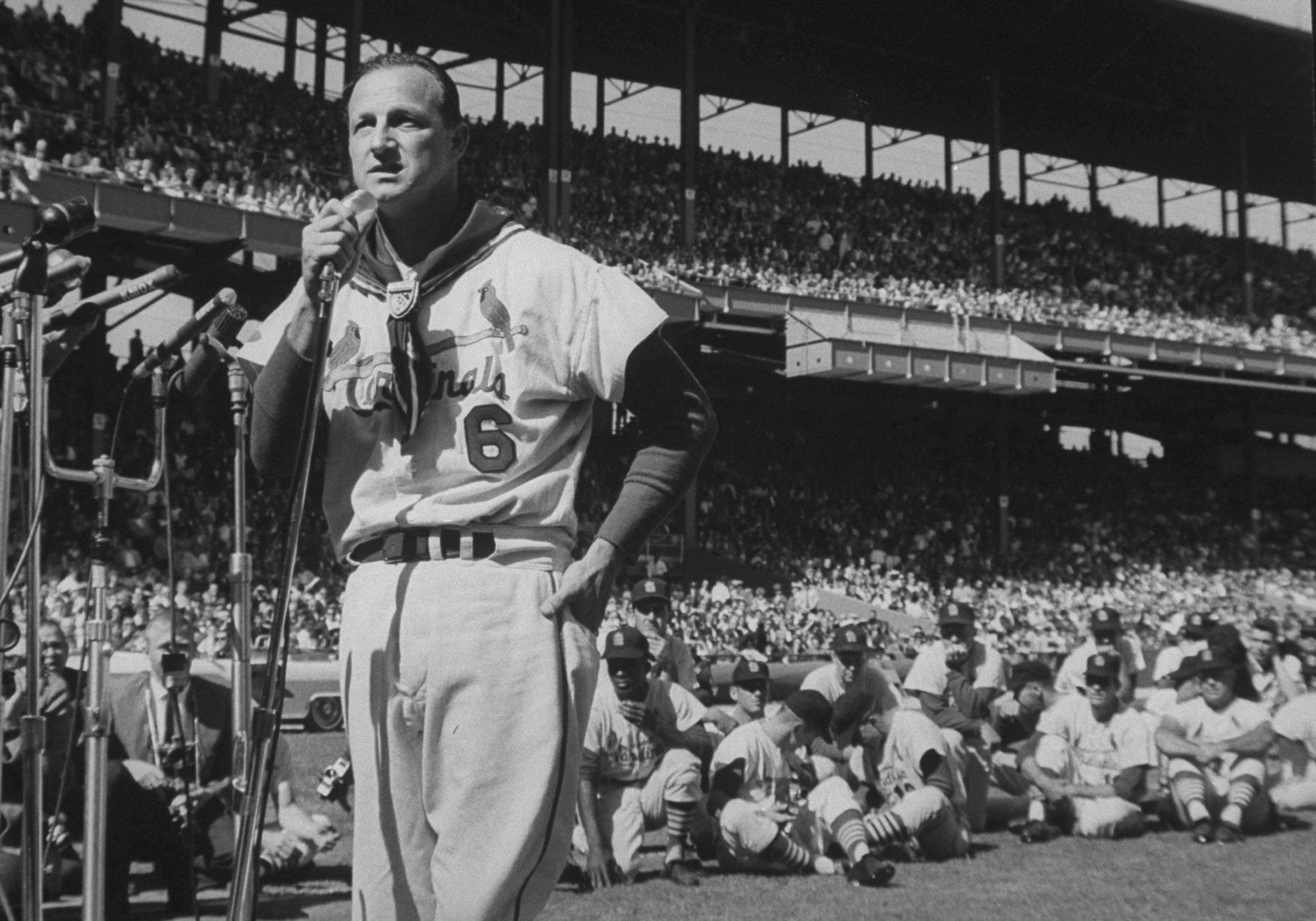 In front of tens of thousands of loyal Cardinals fans, his teammates and the Cincinnati Reds, Stan Musial says goodbye to baseball in September, 1963, after 22 years in a St. Louis uniform.