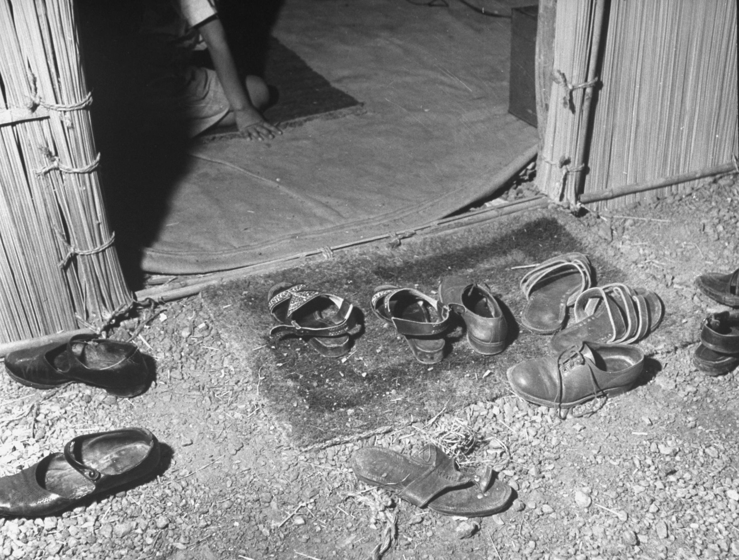 In 1946, an array of sandals and shoes lie outside the doorway of the flat occupied by Gandhi's personal secretary.