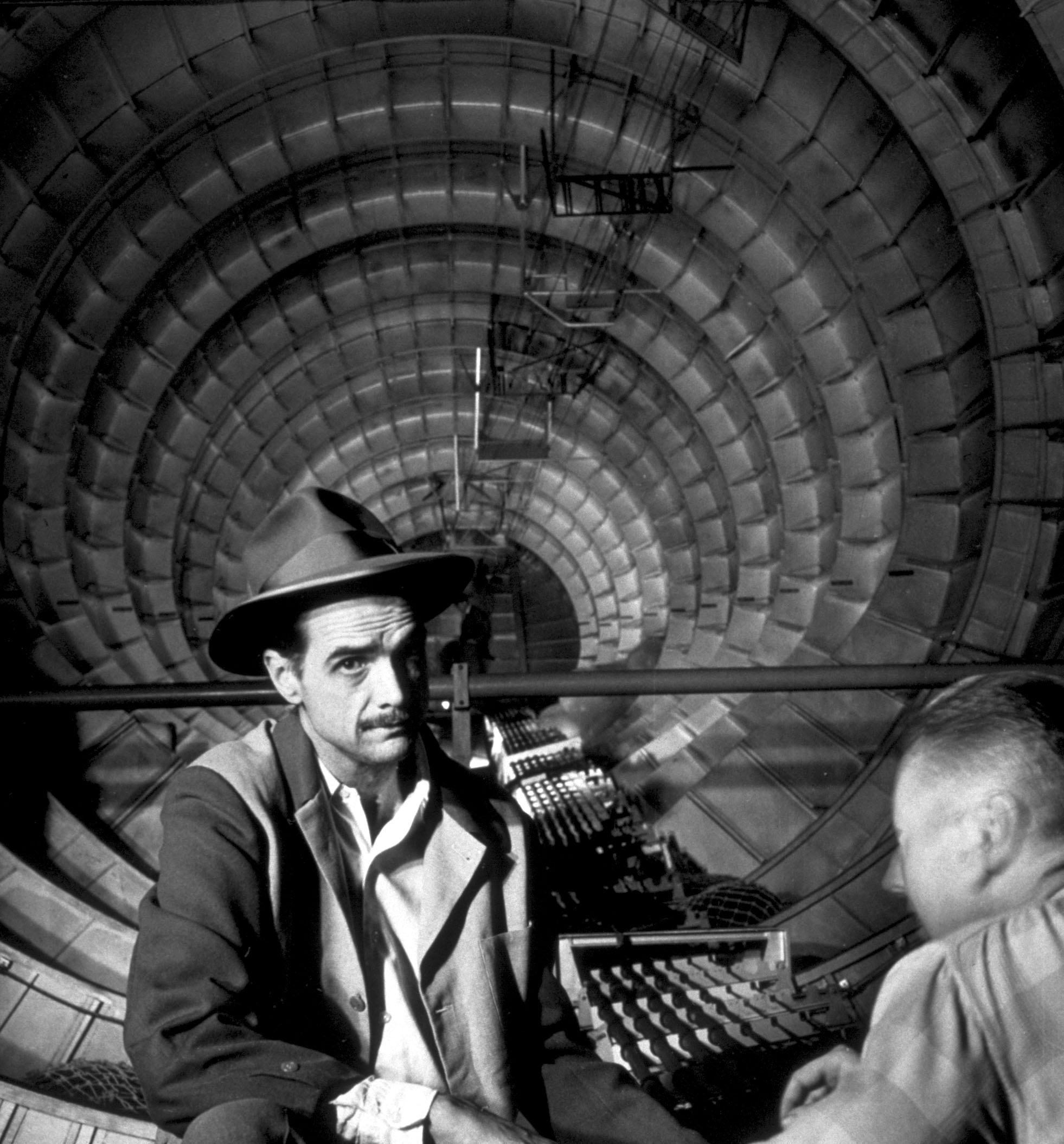 The industrialist, aviator, and film producer Howard Hughes sits with an engineer inside the cavernous sea plane, "the Spruce Goose," in Los Angeles on November 6, 1947.