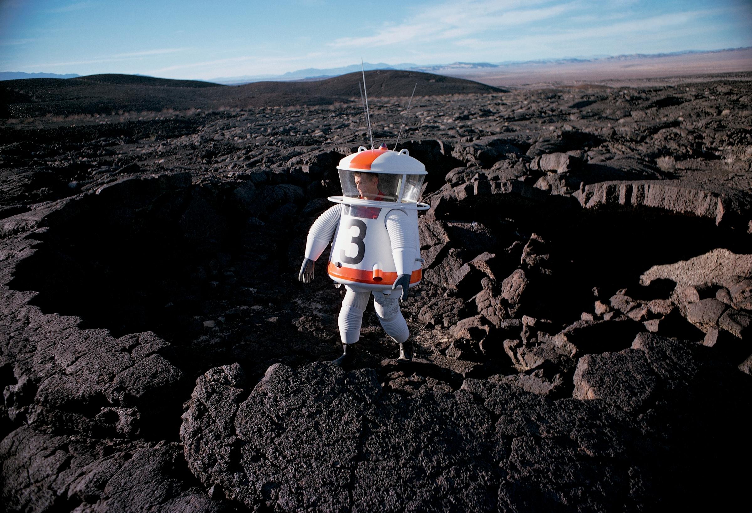 Allyn Hazard tests his "moon suit mock-up" in a lava crater in the Mojave Desert for the April 27, 1962 issue of LIFE.
