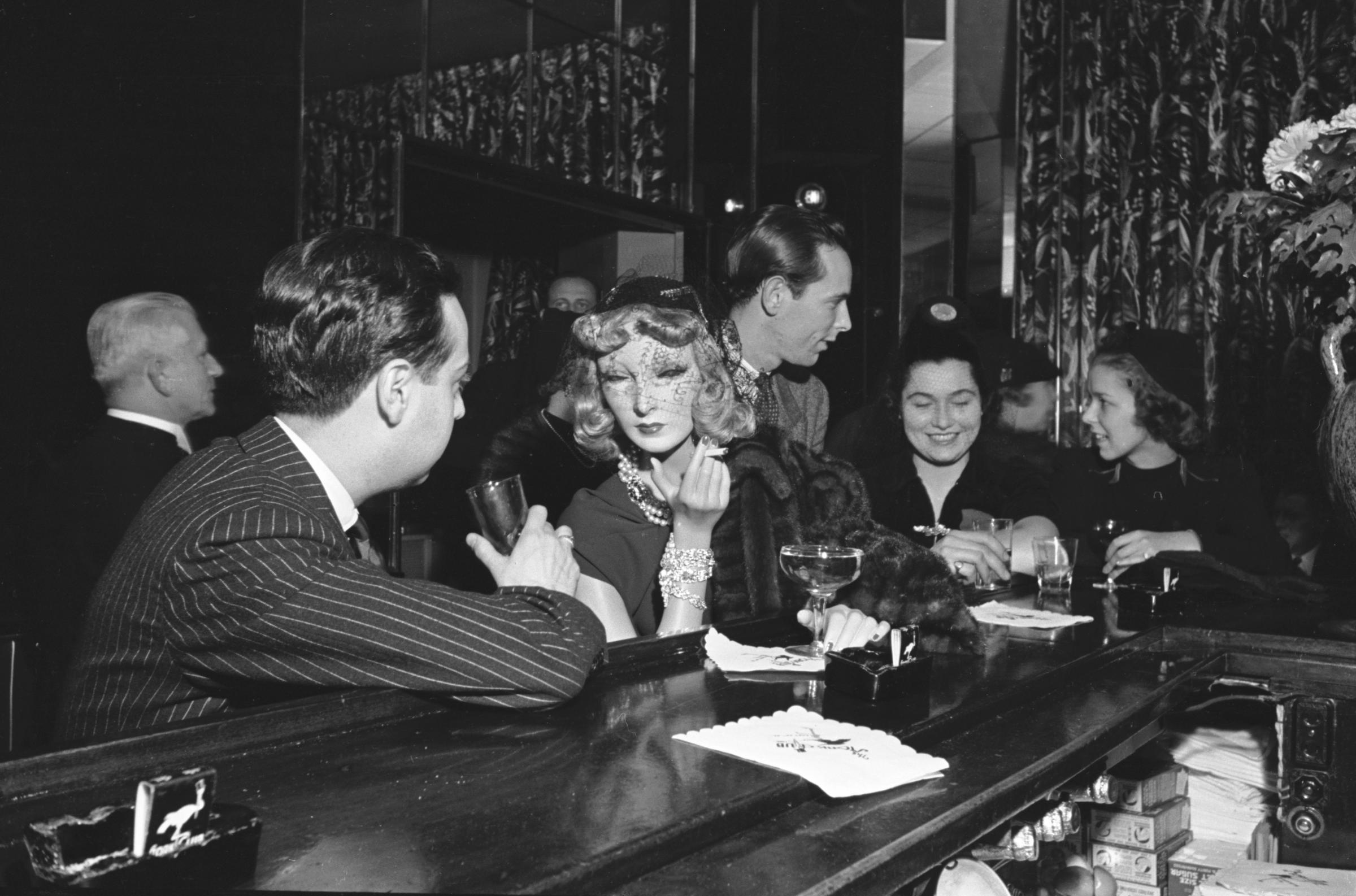 Artist Lester Gabba and his lifelike mannequin Cynthia, created for Saks Fifth Avenue, enjoy a drink at the Stork Club.