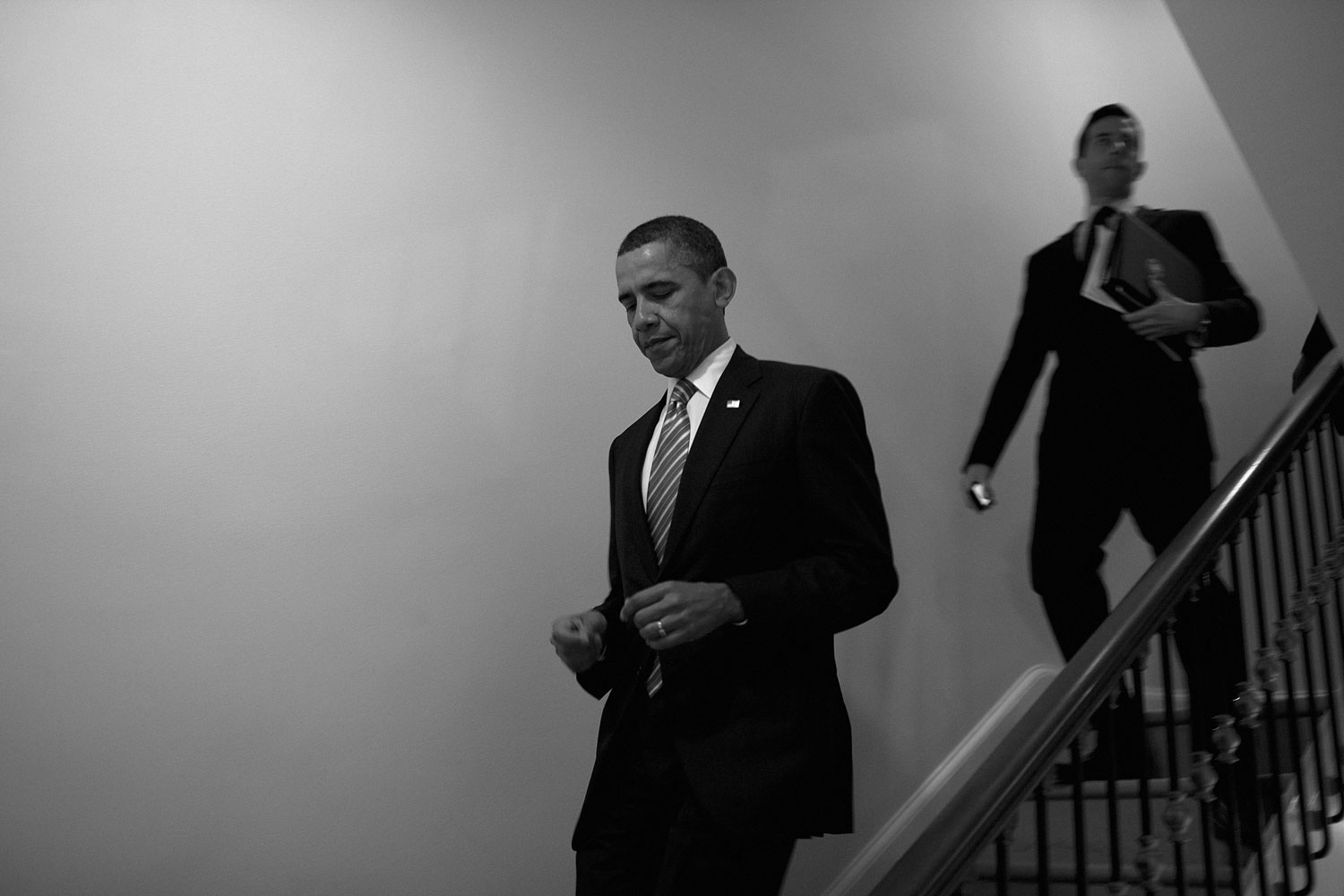 January 17, 2012. Obama walks down to the ground floor to return to the Oval Office, after the St. Louis Cardinals event.