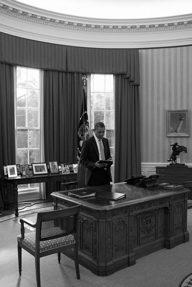 January 17, 2012. Obama reads on his iPad in the Oval Office.