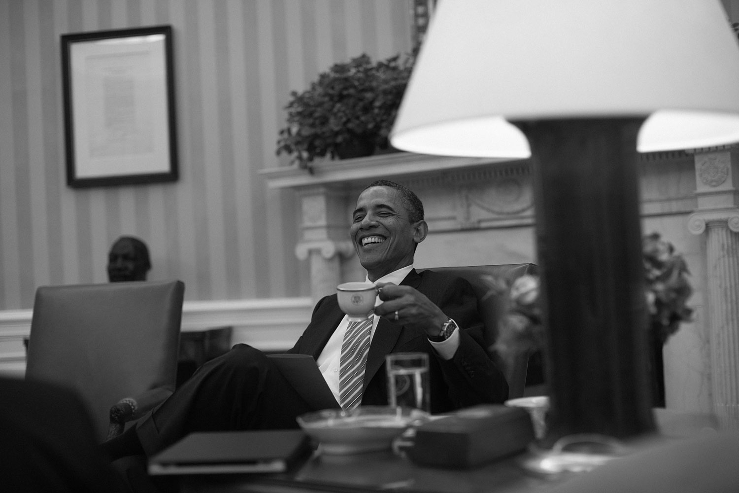 January 17, 2012. President Obama sits in the Oval Office to discuss his State of the Union Address with speechwriters at the end of the day.