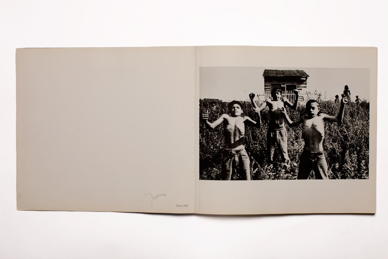 The original printing of Gypsies boils down hundreds of images shot over six years into a tightly edited sequence of 60 photographs, starting with the opening image of three boys flexing their arms and drawing in their stomachs in a show of strength.