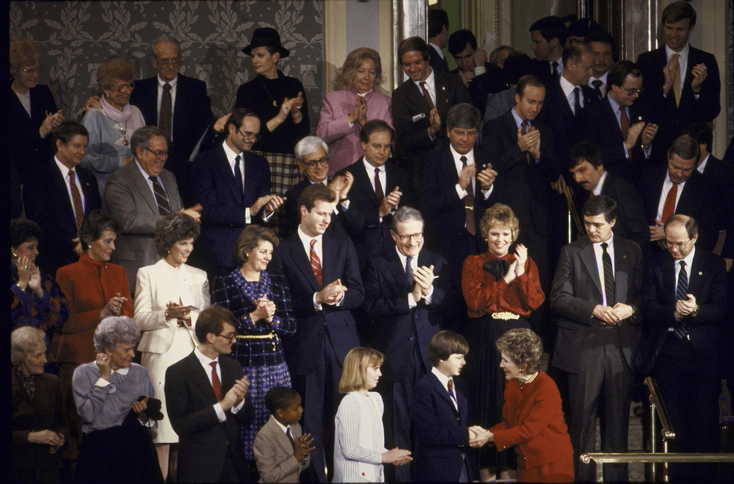 First Lady Nancy Reagan (front in red dress) at Reagan's