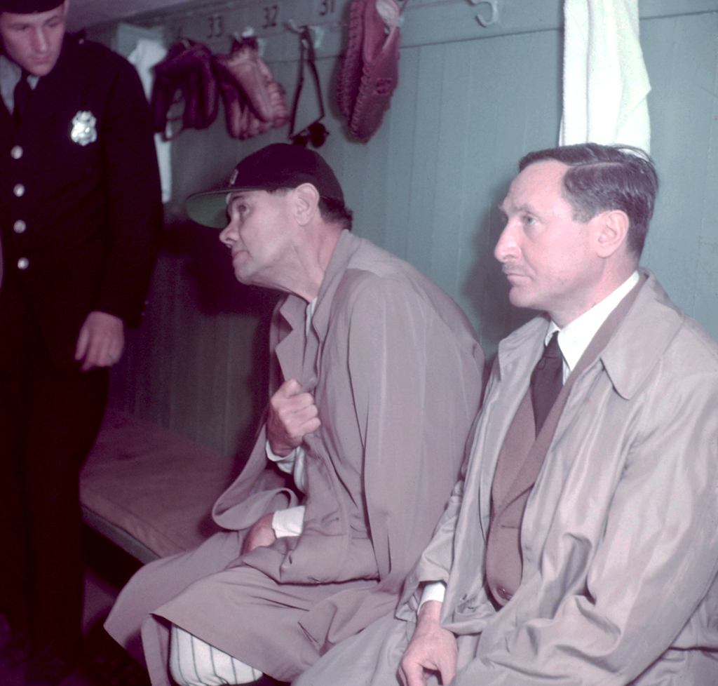 Babe Ruth and two unidentified men in the locker room at Yankee Stadium, June 13, 1948.