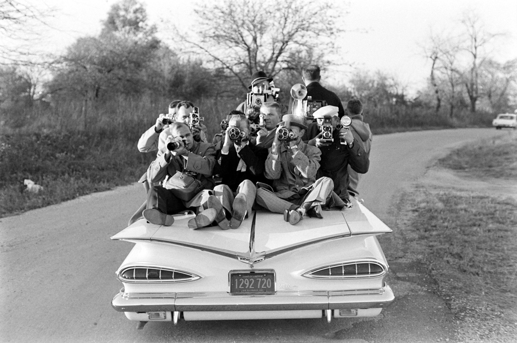 On a drive through Illinois, Paul Schutzer turns his camera on his colleagues in the press, 1960.