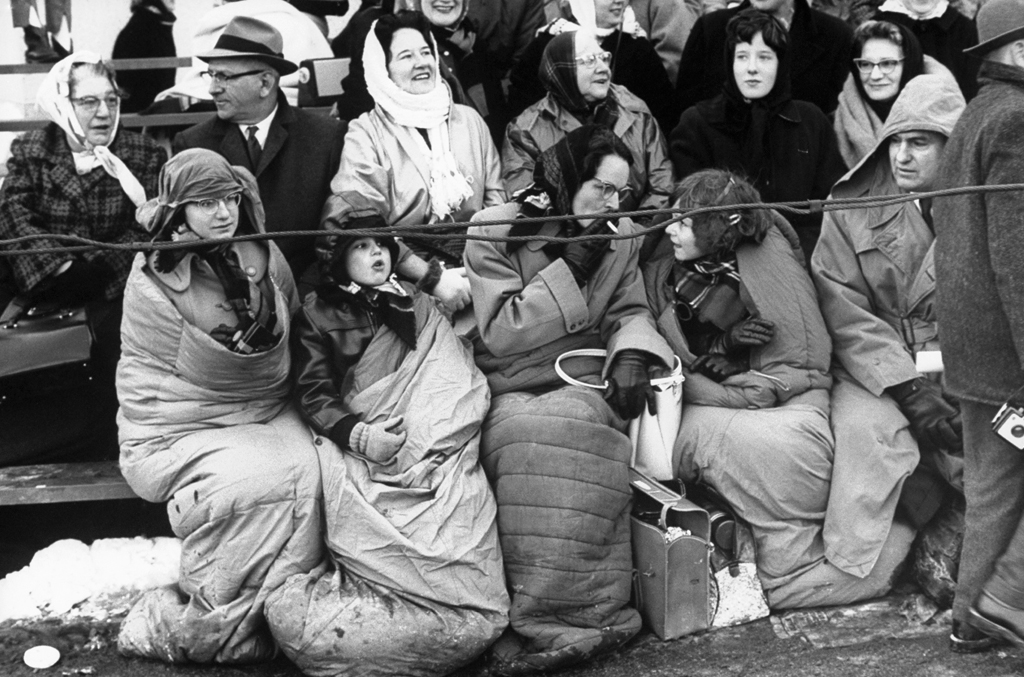 Bundled onlookers gather on Pennsylyvania Avenue on the day of John Kennedy's inauguration.