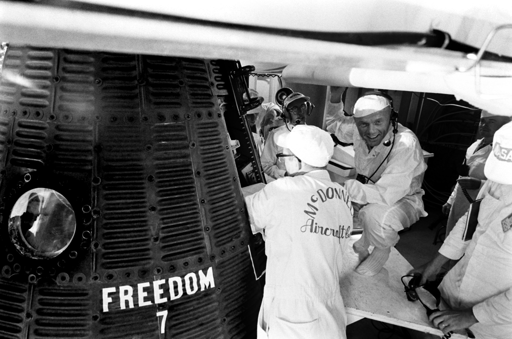John Glenn checks capsule at time of Alan Shepard's May 1961flight.