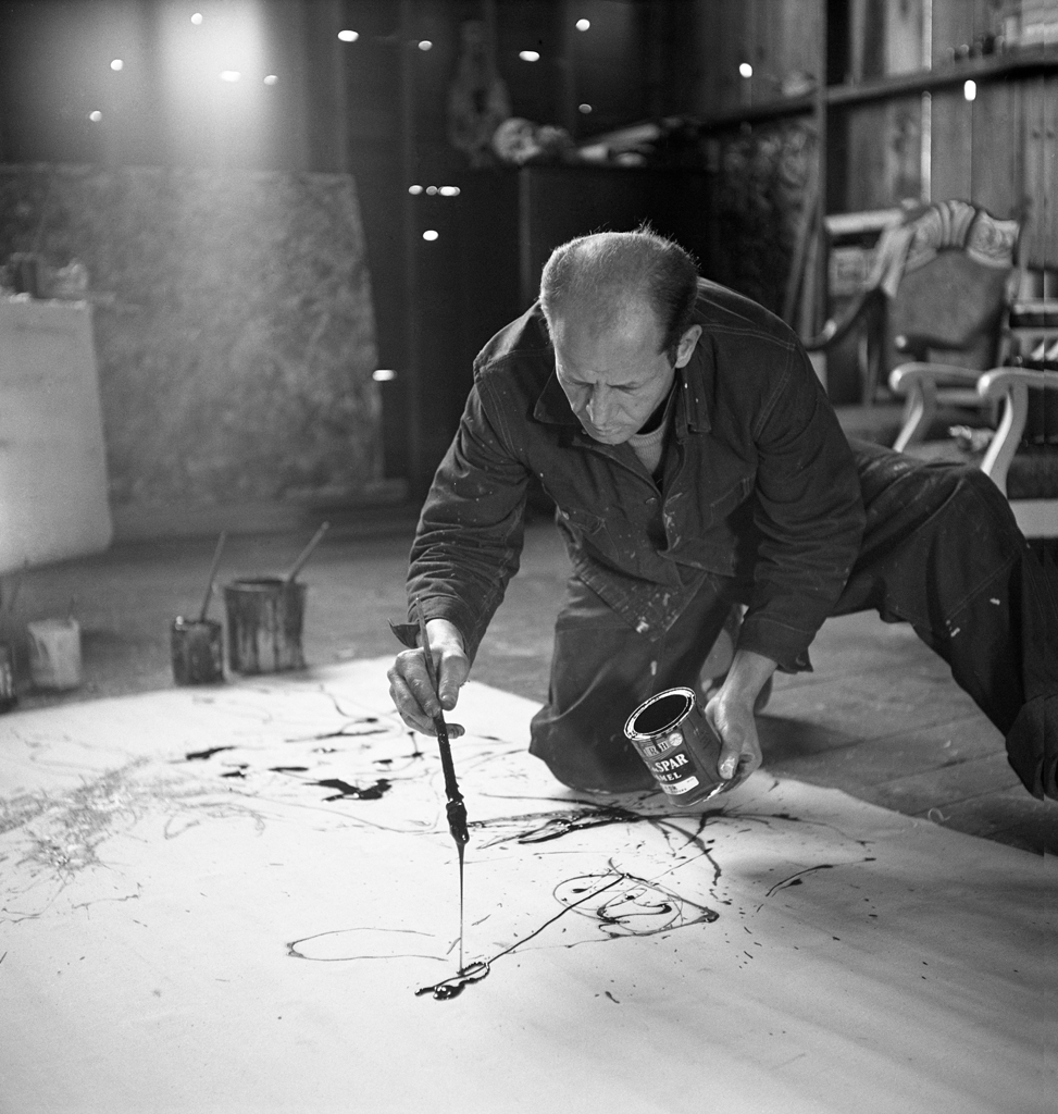 Jackson Pollock works in his Long Island studio, 1949.
