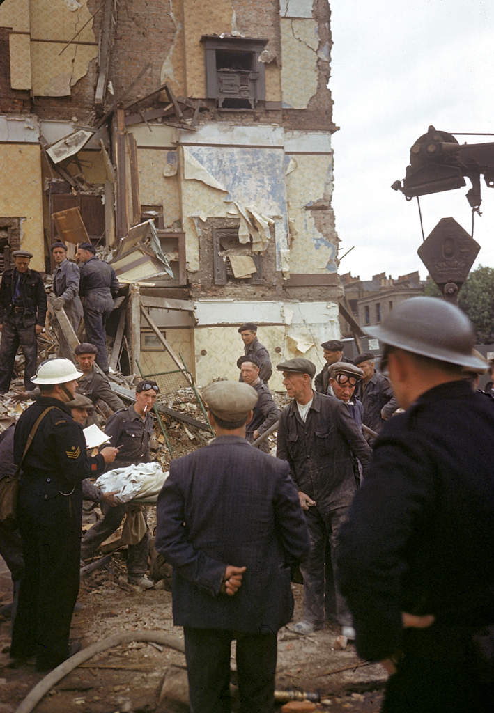 A London Civil Defense Rescue crew helps remove injured and dead civilians from destroyed buildings, London, 1940.