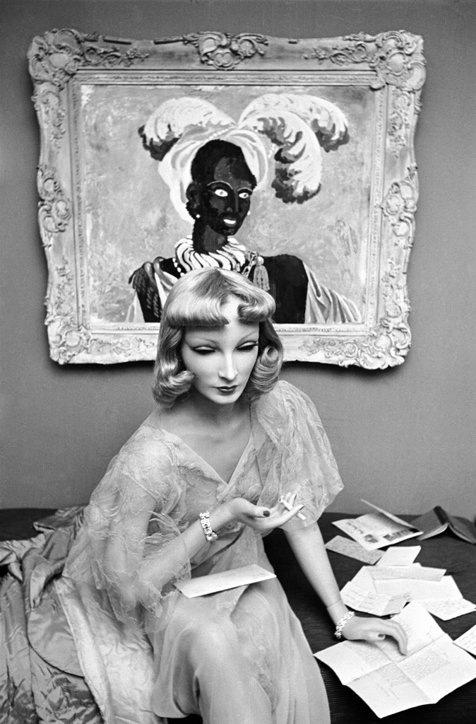 Cynthia the mannequin relaxes at Lester Gaba's apartment in New York in 1937. One of Gaba's paintings is behind her on the wall.