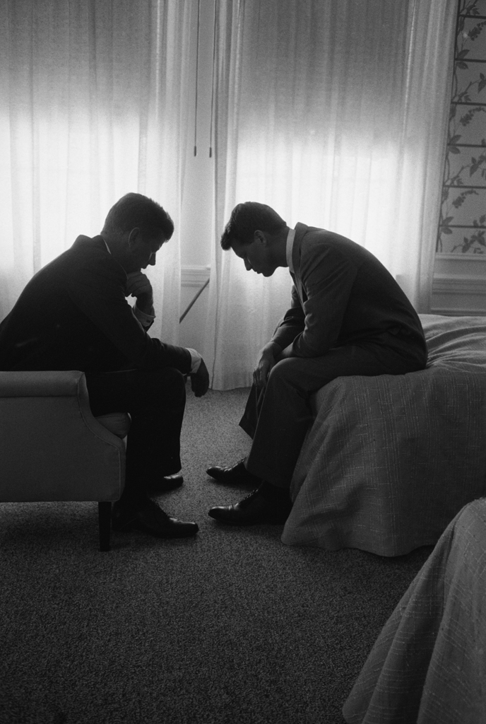 Senator and presidential candidate John F. Kennedy (left) and his campaign manager, Robert Kennedy, confer in a hotel room during the Democratic National Convention, Los Angeles, July 1960.