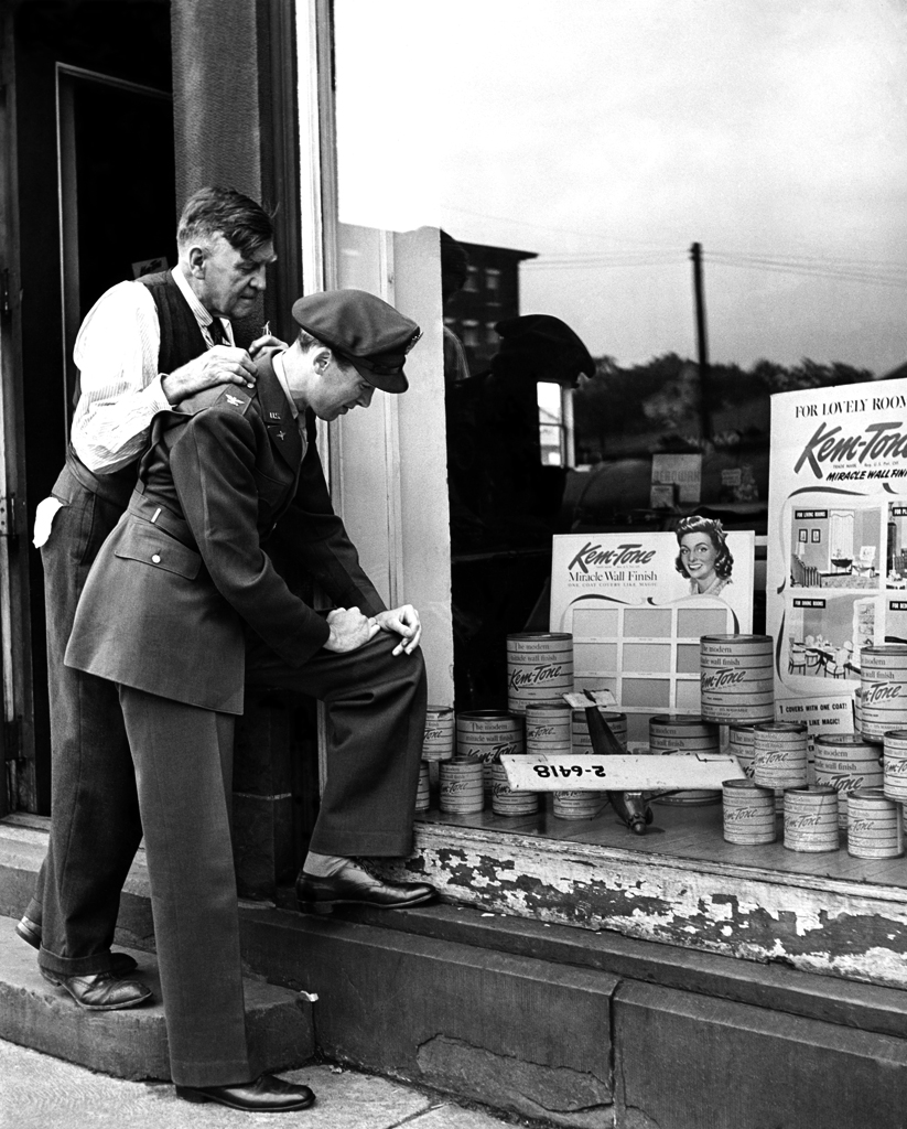 James Stewart looks in his family's hardware store window and spots a model plane he'd built years earlier, 1945.