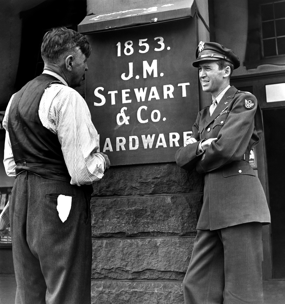 Jimmy Stewart and his dad outside the family hardware store, Indiana, Pa., 1945.